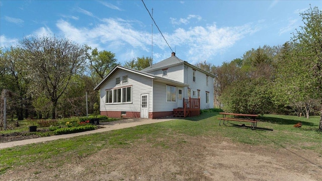 view of home's exterior with a lawn