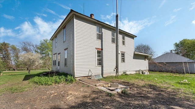 view of side of property with a chimney