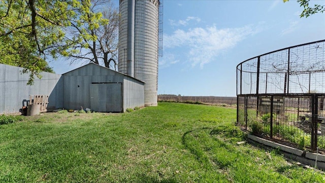 view of yard with a storage unit and an outdoor structure