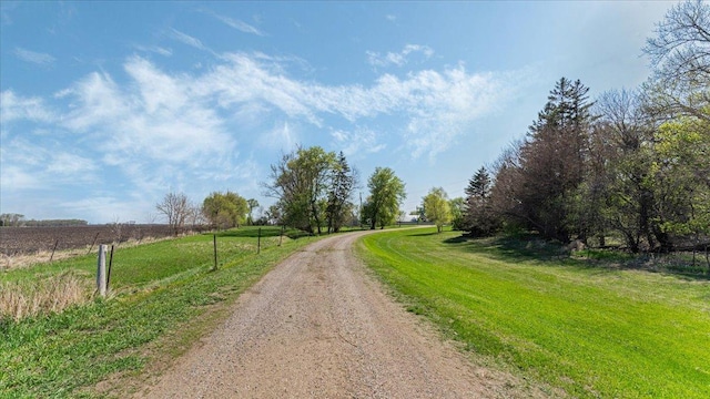 view of dirt / gravel road featuring a rural view
