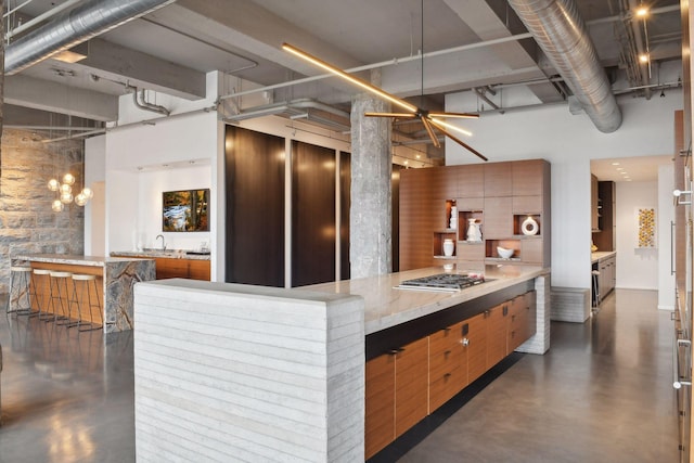 700 2nd St Unit W31, Minneapolis, MN 55401 - kitchen with a towering ceiling, stainless steel gas stovetop, and concrete flooring