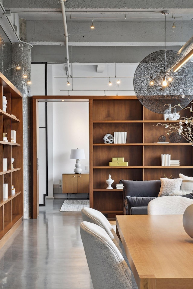 700 2nd St Unit W31, Minneapolis, MN 55401 - living area featuring rail lighting, a towering ceiling, and wood finished floors