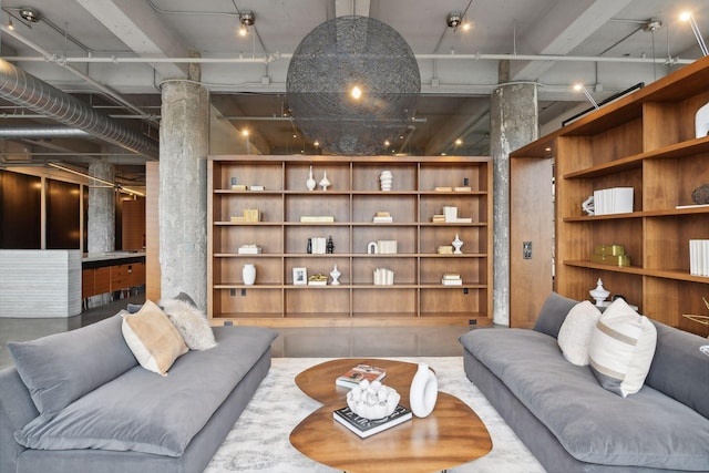 700 2nd St Unit W31, Minneapolis, MN 55401 - living room featuring concrete flooring and decorative columns