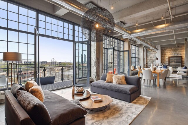 700 2nd St Unit W31, Minneapolis, MN 55401 - living room with finished concrete floors, a towering ceiling, and floor to ceiling windows