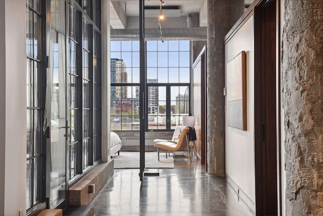 700 2nd St Unit W31, Minneapolis, MN 55401 - interior space featuring a city view, a wealth of natural light, concrete flooring, and a towering ceiling
