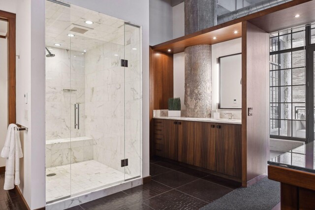 700 2nd St Unit W31, Minneapolis, MN 55401 - full bathroom featuring a marble finish shower, a wealth of natural light, and vanity