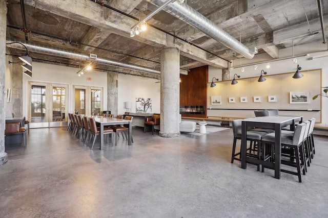 700 2nd St Unit W31, Minneapolis, MN 55401 - dining area with french doors, finished concrete floors, and a towering ceiling