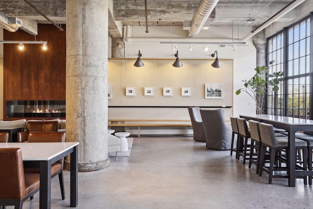 700 2nd St Unit W31, Minneapolis, MN 55401 - interior space featuring concrete flooring, baseboard heating, and a high ceiling