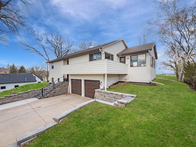 10823 Big Chip Rd NW, Brandon Twp, MN 56315 - rear view of property featuring an attached garage, concrete driveway, a yard, and stairway