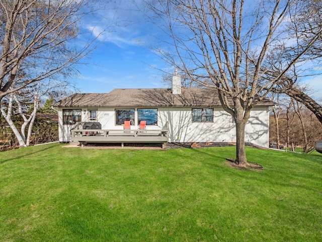 10823 Big Chip Rd NW, Brandon Twp, MN 56315 - back of house with a chimney, a wooden deck, and a lawn