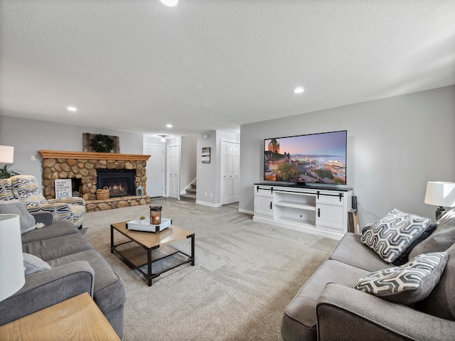 10823 Big Chip Rd NW, Brandon Twp, MN 56315 - living area featuring recessed lighting, a textured ceiling, stairs, a stone fireplace, and light carpet