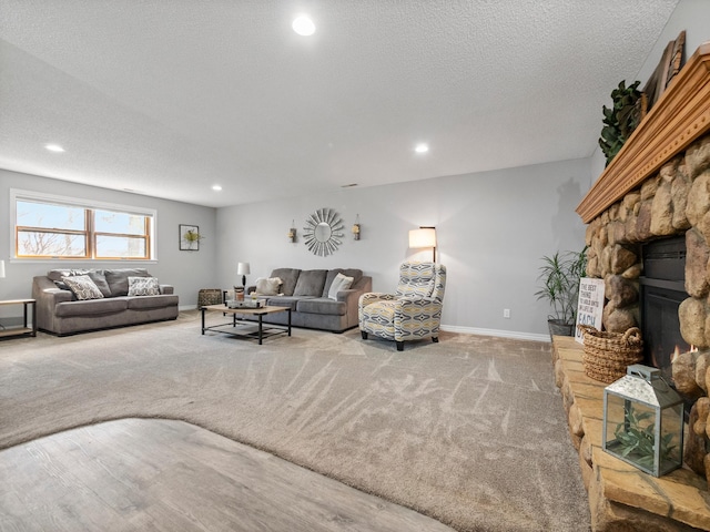 10823 Big Chip Rd NW, Brandon Twp, MN 56315 - carpeted living area featuring recessed lighting, a textured ceiling, and a fireplace