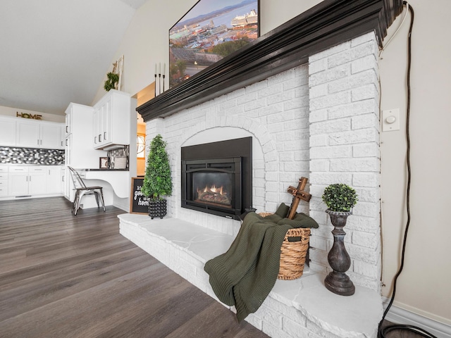 10823 Big Chip Rd NW, Brandon Twp, MN 56315 - living area featuring dark wood finished floors, a brick fireplace, and high vaulted ceiling