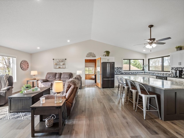 10823 Big Chip Rd NW, Brandon Twp, MN 56315 - living room featuring lofted ceiling, light wood-style flooring, plenty of natural light, ceiling fan, and recessed lighting
