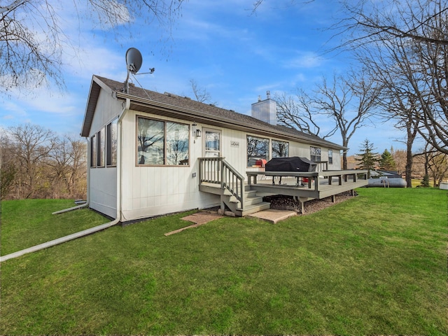 10823 Big Chip Rd NW, Brandon Twp, MN 56315 - rear view of property featuring a chimney, a deck, a lawn, and roof with shingles