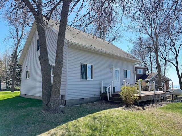 5301 Oak St, Isle, MN 56342 - back of property featuring crawl space, a deck, and a lawn