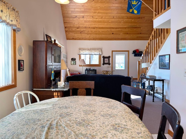 5301 Oak St, Isle, MN 56342 - carpeted dining room featuring wood ceiling, high vaulted ceiling, and stairs