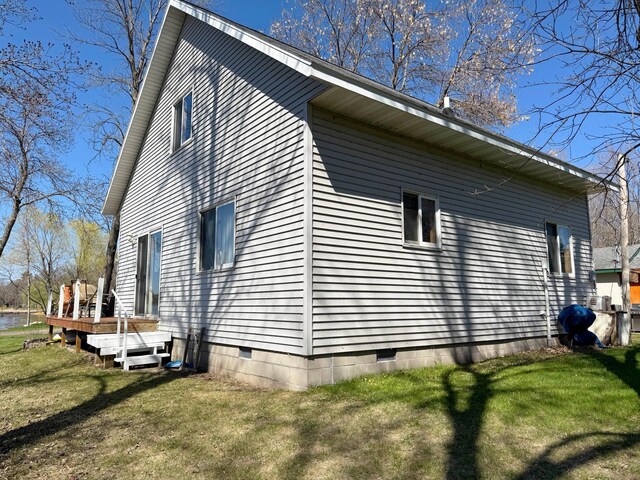 5301 Oak St, Isle, MN 56342 - view of property exterior with crawl space, a lawn, and a wooden deck