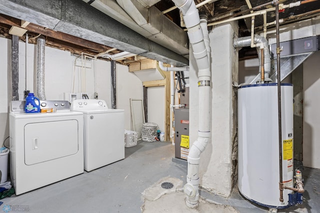 unfinished basement with gas water heater and washer and dryer