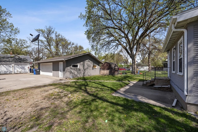 view of side of home featuring an outbuilding, a lawn, and a garage