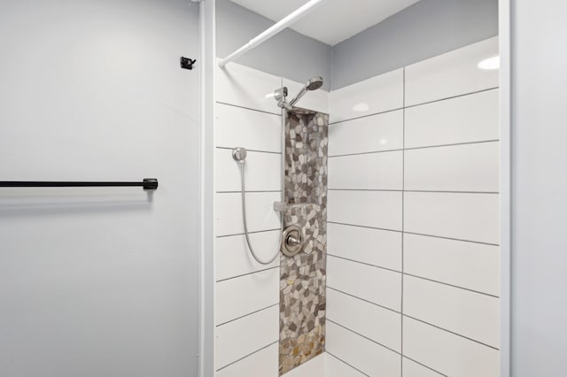 full bathroom with a tile shower