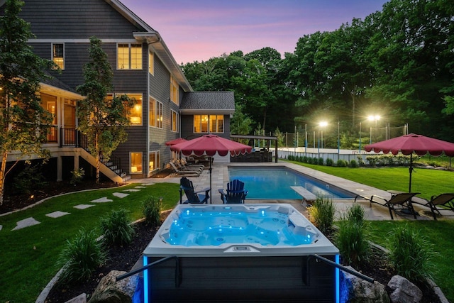 8622 French Curv, Eden Prairie, MN 55347 - pool at dusk with a hot tub, a yard, stairs, a patio area, and an outdoor pool
