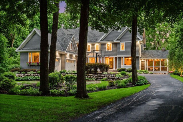 8622 French Curv, Eden Prairie, MN 55347 - view of front facade featuring asphalt driveway, a front yard, and a garage