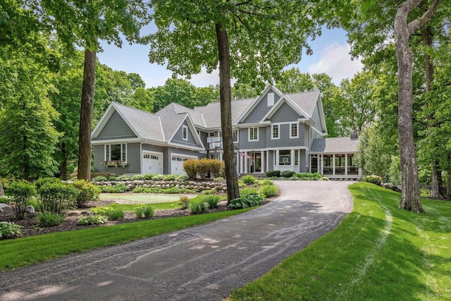 8622 French Curv, Eden Prairie, MN 55347 - shingle-style home featuring asphalt driveway, a front yard, and an attached garage