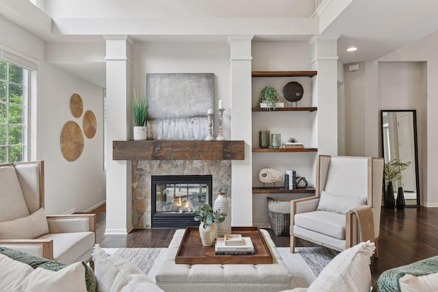 8622 French Curv, Eden Prairie, MN 55347 - living area with decorative columns, wood finished floors, a glass covered fireplace, baseboards, and recessed lighting