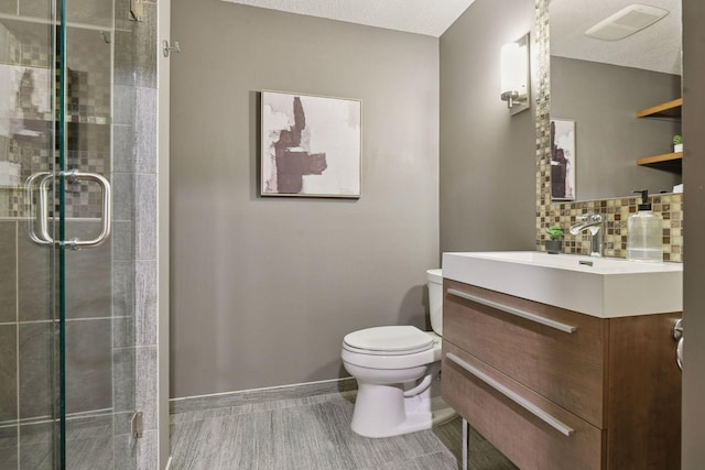 8622 French Curv, Eden Prairie, MN 55347 - bathroom featuring vanity, toilet, a stall shower, and baseboards