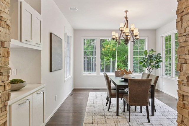 8622 French Curv, Eden Prairie, MN 55347 - dining space featuring plenty of natural light, hardwood / wood-style floors, a chandelier, and baseboards