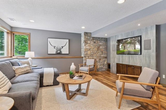 8622 French Curv, Eden Prairie, MN 55347 - living area with a textured ceiling, wood finished floors, and recessed lighting