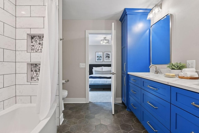 8622 French Curv, Eden Prairie, MN 55347 - ensuite bathroom featuring double vanity, toilet, shower / bath combination with curtain, and tile patterned floors