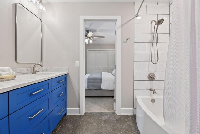 8622 French Curv, Eden Prairie, MN 55347 - ensuite bathroom with vanity, a ceiling fan, shower / tub combo with curtain, tile patterned flooring, and baseboards