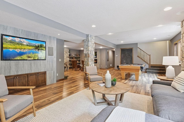 8622 French Curv, Eden Prairie, MN 55347 - living room with ornate columns, light wood finished floors, stairway, baseboards, and recessed lighting