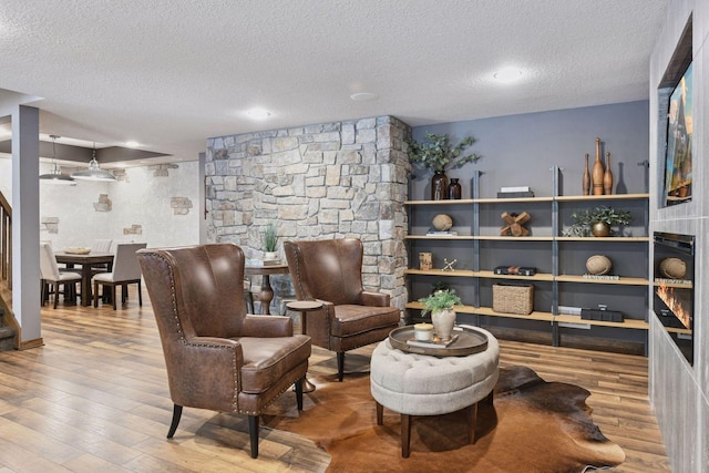 8622 French Curv, Eden Prairie, MN 55347 - sitting room featuring a textured ceiling and wood finished floors