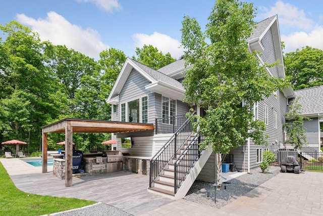 8622 French Curv, Eden Prairie, MN 55347 - view of front of home featuring an outdoor kitchen, a patio area, and stairs
