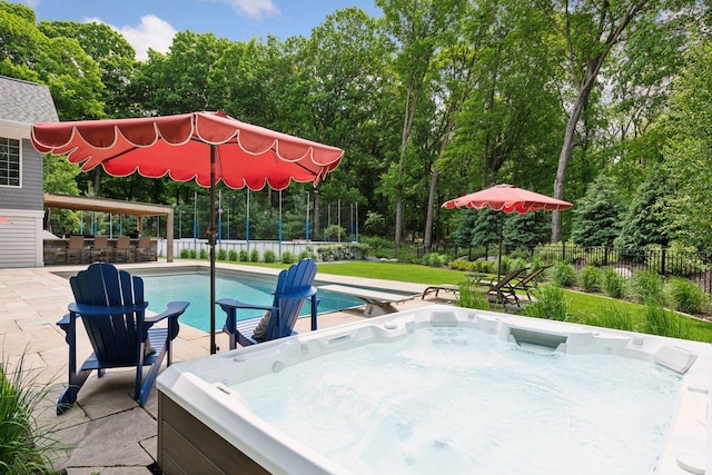 8622 French Curv, Eden Prairie, MN 55347 - view of swimming pool featuring a hot tub, a patio area, and view of scattered trees