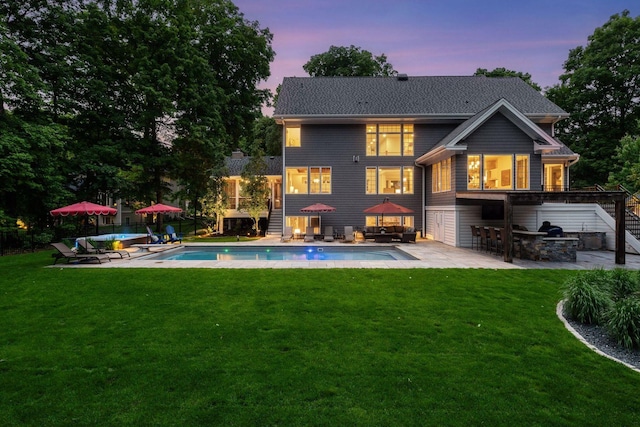 8622 French Curv, Eden Prairie, MN 55347 - back of property at dusk featuring an outdoor pool, a patio area, outdoor lounge area, and stairway