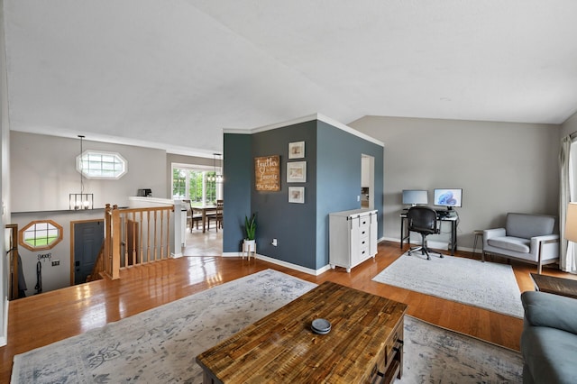 14380 Geneva Ave N, Hugo, MN 55038 - living area featuring wood finished floors, lofted ceiling, and baseboards