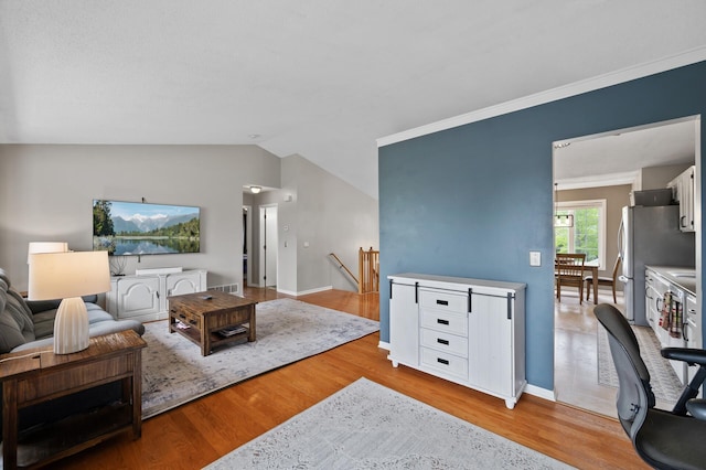 14380 Geneva Ave N, Hugo, MN 55038 - living area with wood finished floors, lofted ceiling, and baseboards