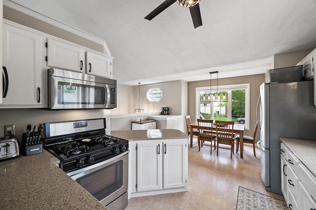14380 Geneva Ave N, Hugo, MN 55038 - kitchen featuring appliances with stainless steel finishes, ceiling fan, white cabinetry, hanging light fixtures, and light stone countertops