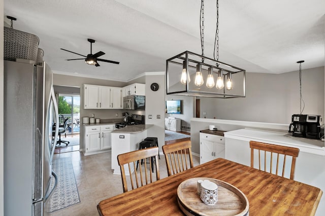 14380 Geneva Ave N, Hugo, MN 55038 - dining space featuring ceiling fan, light tile patterned flooring, and ornamental molding