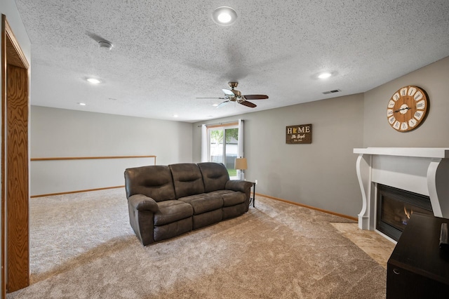14380 Geneva Ave N, Hugo, MN 55038 - carpeted living room with ceiling fan, a fireplace with flush hearth, recessed lighting, baseboards, and a textured ceiling