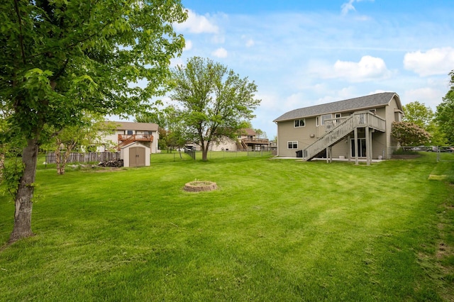 14380 Geneva Ave N, Hugo, MN 55038 - view of yard featuring stairs, a wooden deck, and an outdoor fire pit