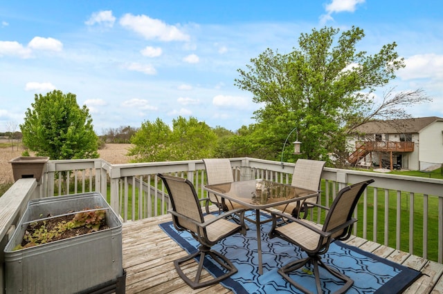 14380 Geneva Ave N, Hugo, MN 55038 - wooden terrace featuring outdoor dining space and a yard