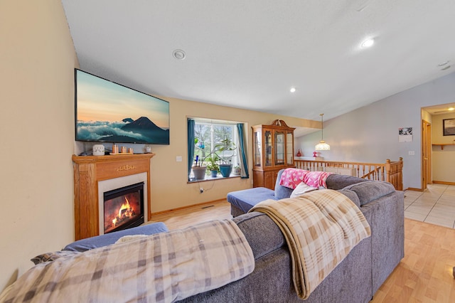 1320 18th St SE, Owatonna, MN 55060 - living room featuring a glass covered fireplace, recessed lighting, and wood finished floors