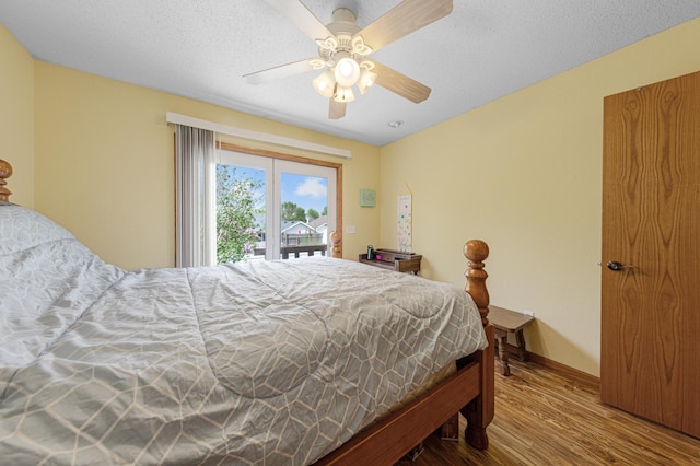 1320 18th St SE, Owatonna, MN 55060 - bedroom featuring wood finished floors, access to exterior, a ceiling fan, and baseboards