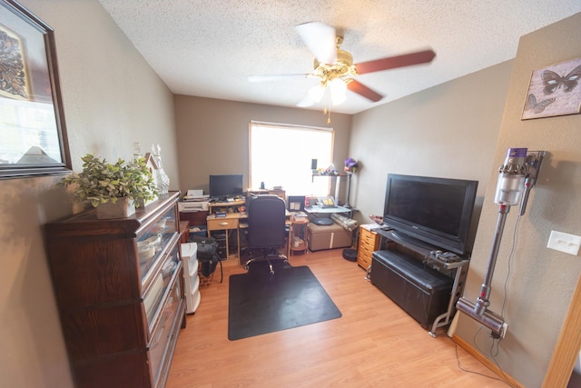 1320 18th St SE, Owatonna, MN 55060 - office featuring light wood finished floors, ceiling fan, and a textured ceiling