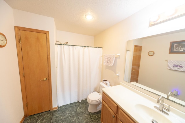 1320 18th St SE, Owatonna, MN 55060 - bathroom with vanity and a textured ceiling